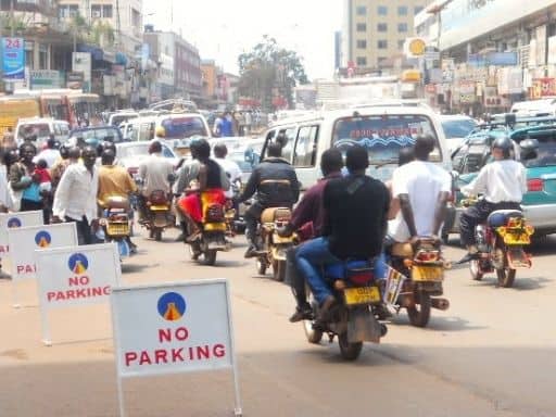 Boda bodas are a common form of transportation in Uganda. Tourists walking in Kampala should be alert in order to keep safe.